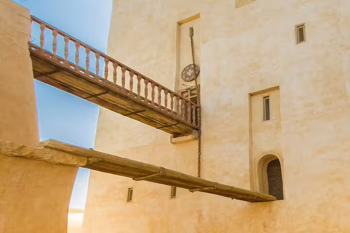 Wooden bridge and tower inside Wadi El Natroun monastery on day tour from Cairo, Egypt desert heritage