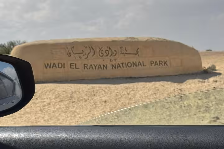 Wadi El Rayan National Park entrance sign in Fayoum, a key stop on a private full-day tour from Cairo