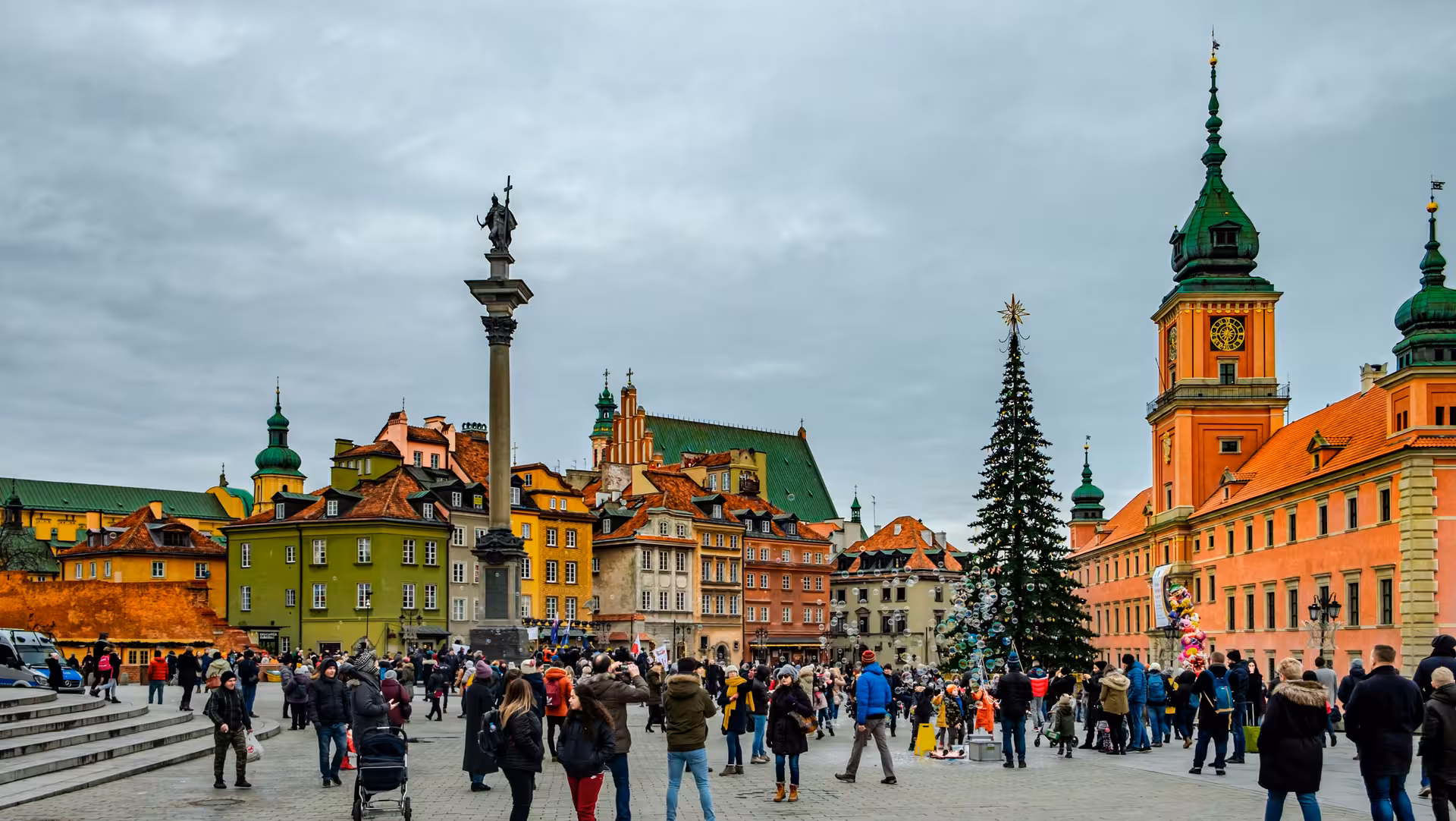 Discover Warsaw's vibrant Old Town with colorful buildings and iconic monuments on a guided city walking tour.