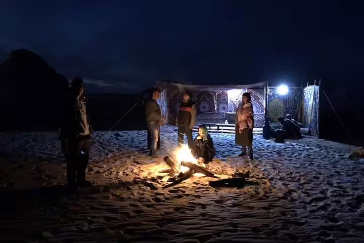 Night desert campfire in Bahariya Oasis with Bedouin tent, stargazing vibe on 3 days 2 nights White Desert tour