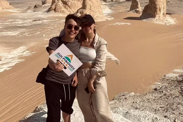 Travelers posing in Egypt’s White Desert near Bahariya Oasis, a highlight of the 3 days 2 nights tour