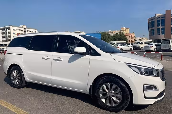 White private minivan for transportation within Dubai and reliable Dubai to Abu Dhabi intercity transfer