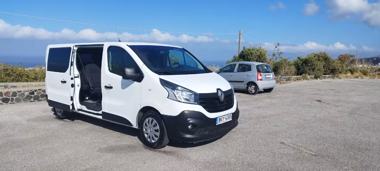 White passenger van with sliding door open, ideal for private airport transfer and hotel pickup service