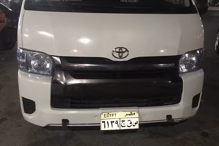 White Toyota van ready for private Luxor airport transfer, reliable pickup or drop-off at Luxor International Airport