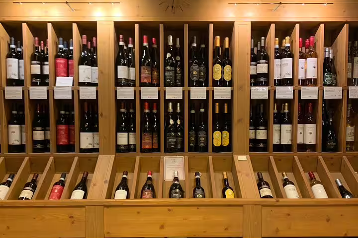 Extensive wine collection display, perfect for wine lovers on a scenic transfer from Venice to Milano.