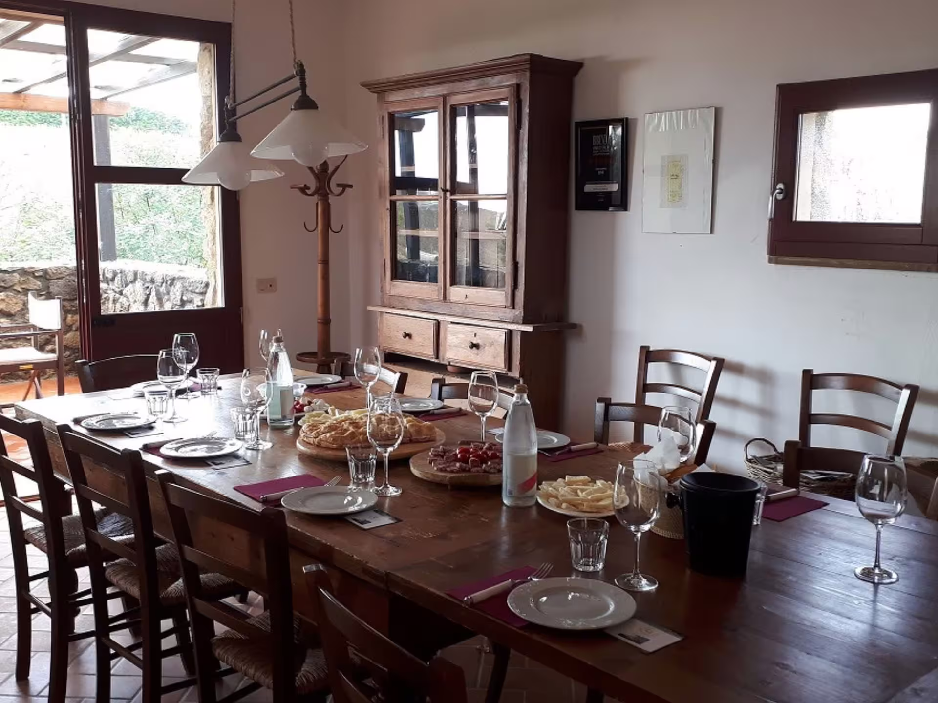Cozy dining room set for wine tasting with local food near Livorno and Pisa.