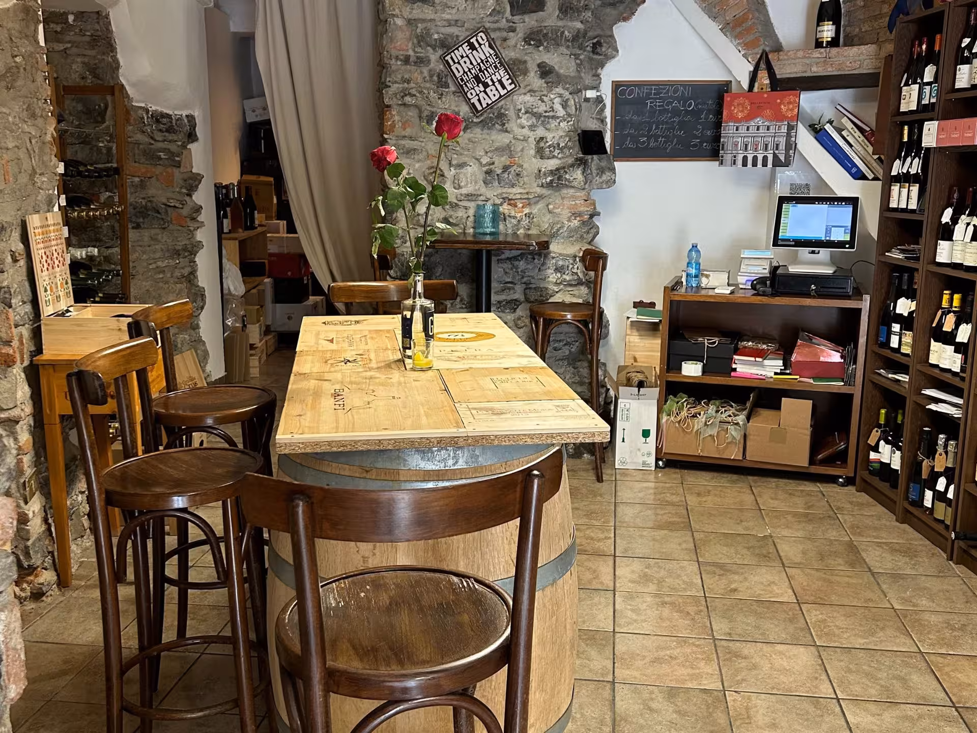 Cozy wine tasting room at Lake Como with rustic decor, ideal for enjoying local wines and authentic ambiance.