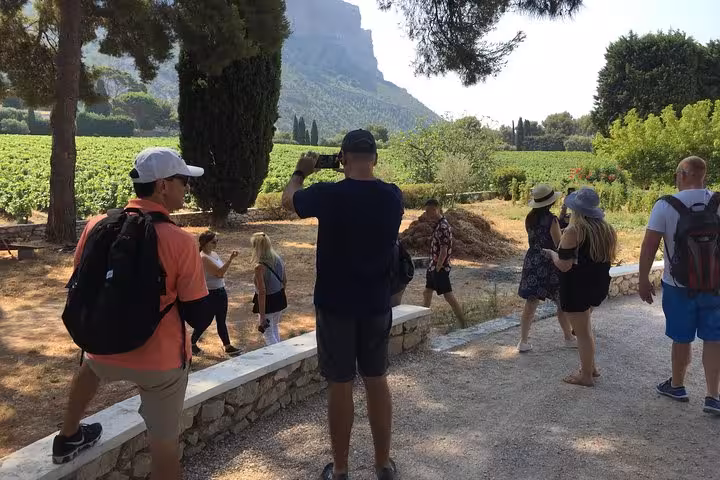 Small group walking through vineyard estate, exploring heritage landscapes on a 3-day wine and food tour