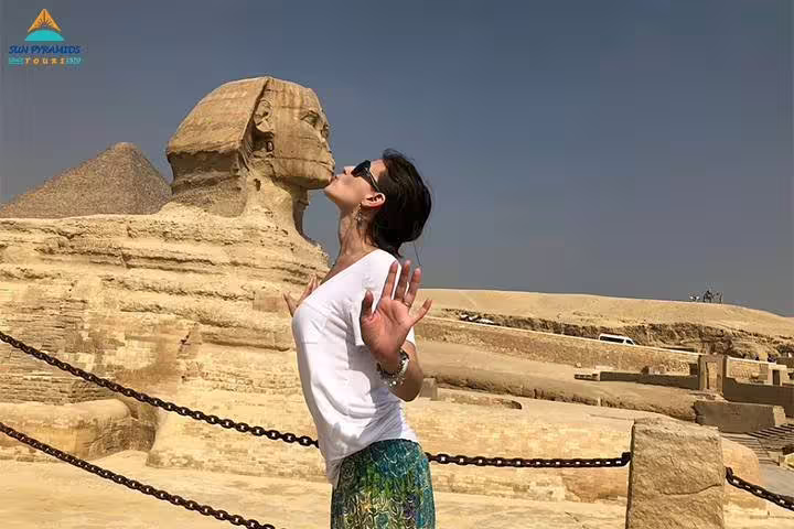 Woman posing by the Great Sphinx and Giza Pyramids, part of 8 days 7 nights Jewels of Egypt tour package