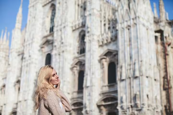 Woman posing by Milan Duomo on a private tour with personal travel photographer for iconic city portraits