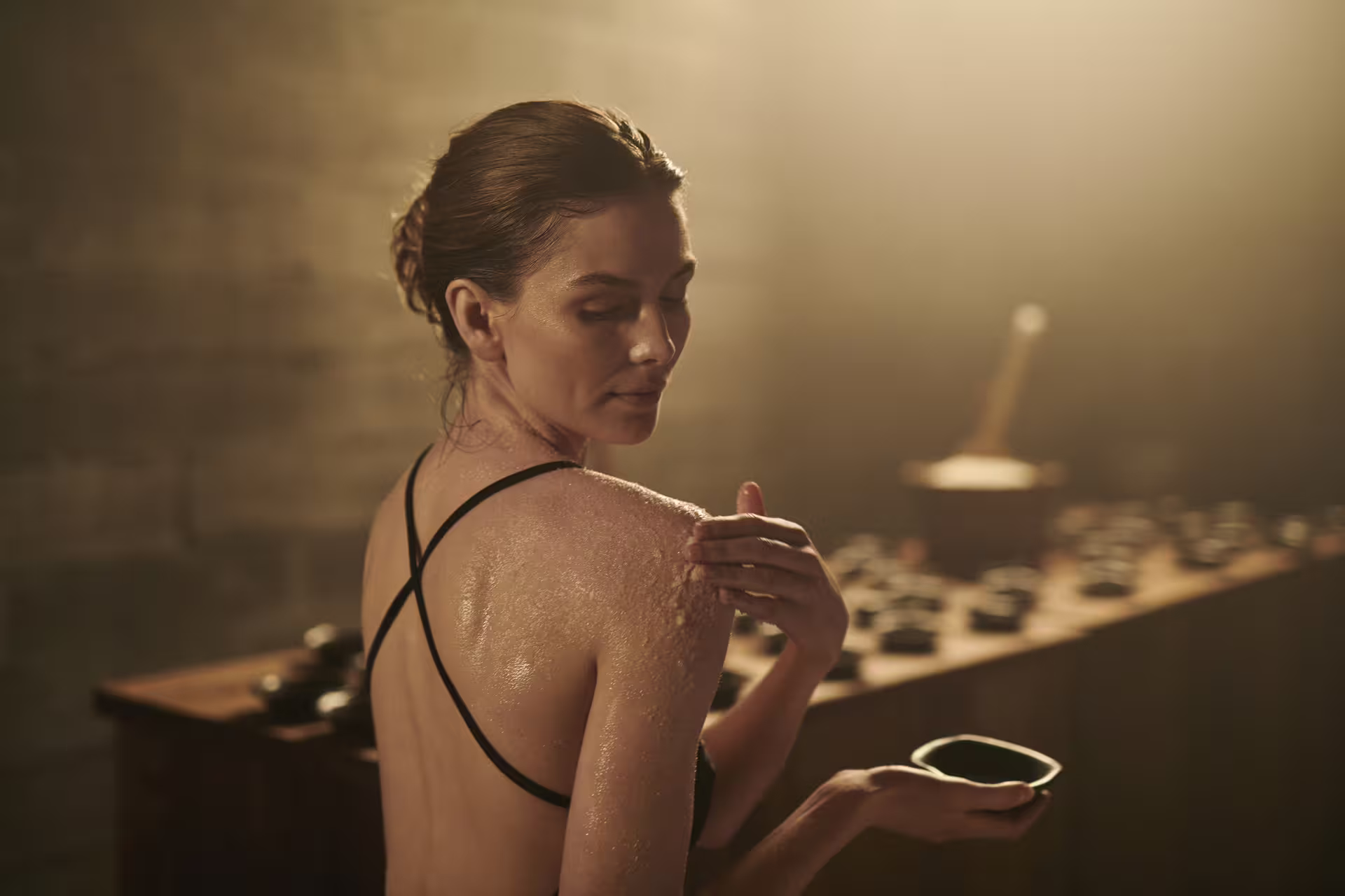 Woman enjoying a rejuvenating spa treatment at Sky Lagoon, highlighting the relaxation aspect of the Golden Circle tour.