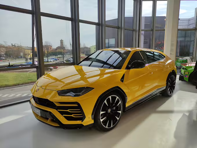 Yellow Lamborghini Urus on display at the Lamborghini Museum near Bologna, combo entry ticket experience