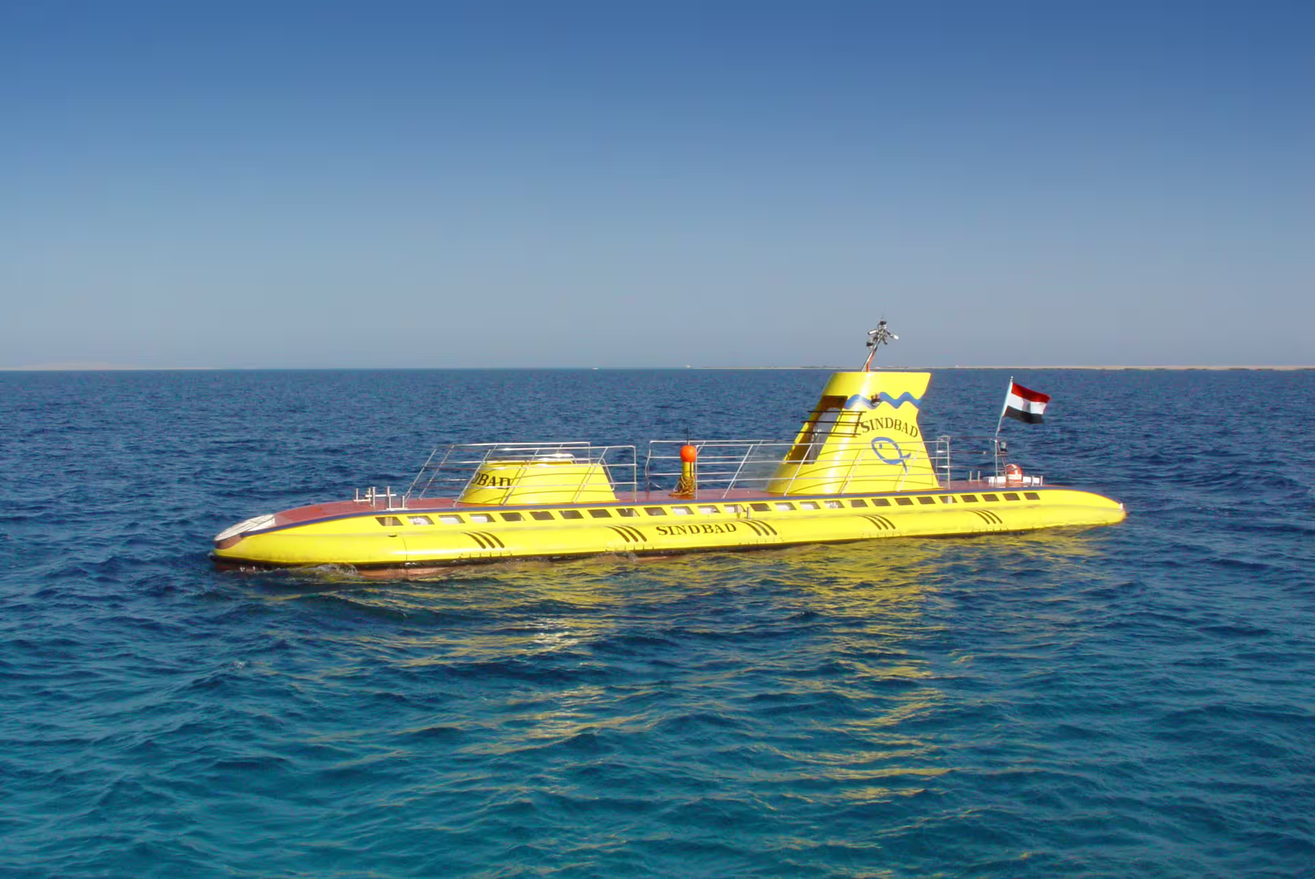 Yellow Sindbad submarine cruising on the Red Sea in Hurghada, Egypt, for an underwater coral reef tour