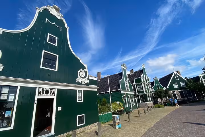 Zaanse Schans green wooden houses and village street on Northern Highlights Tour from Amsterdam