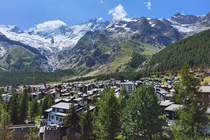 Zermatt village panorama with snowcapped Swiss Alps peaks and forests on a 4-day Zermatt Jungfrau tour