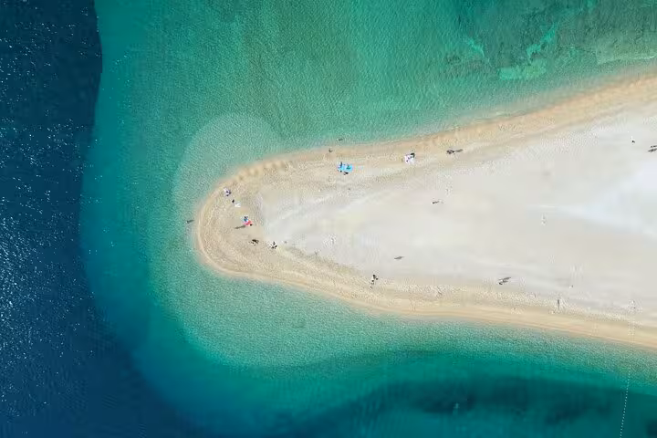 Aerial view of Zlatni Rat Golden Horn Beach sandbar and turquoise Adriatic on Hvar private boat tour