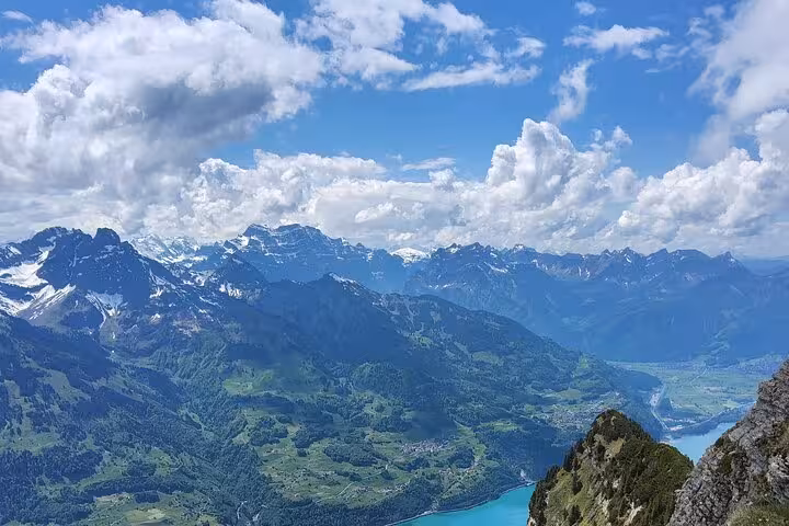 Panoramic Swiss Alps view from Leistkamm Ridge hike on guided day trip from Zurich above Walensee