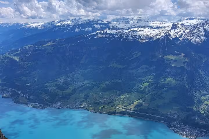 Panoramic Walensee shoreline from Leistkamm Ridge guided hike, snowcapped Swiss Alps day trip from Zurich
