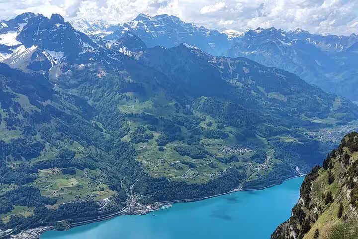 Panoramic view over turquoise Walensee and Swiss Alps from Leistkamm Ridge on a Zurich guided hike