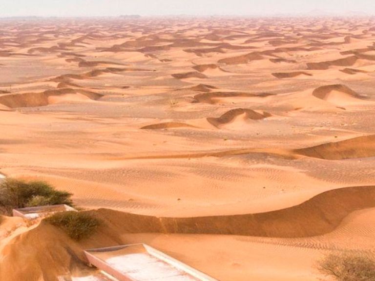 Al Madam, a deserted village near Dubai, lures adventurous travelers with its enigmatic allure. Abandoned in shifting desert sands, its decaying structures and eerie stillness evoke a captivating, haunting ambiance for exploration.