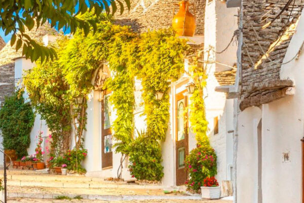 Alberobello, in Italy's Bari province, charms visitors with its iconic trulli houses—traditional stone dwellings with distinctive conical roofs. A UNESCO World Heritage Site, it's a top tourist attraction.