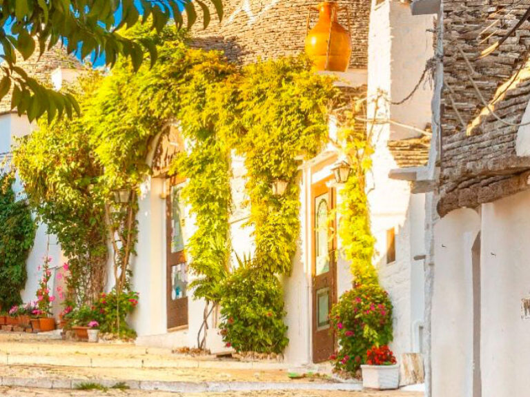 Alberobello, in Italy's Bari province, charms visitors with its iconic trulli houses—traditional stone dwellings with distinctive conical roofs. A UNESCO World Heritage Site, it's a top tourist attraction.
