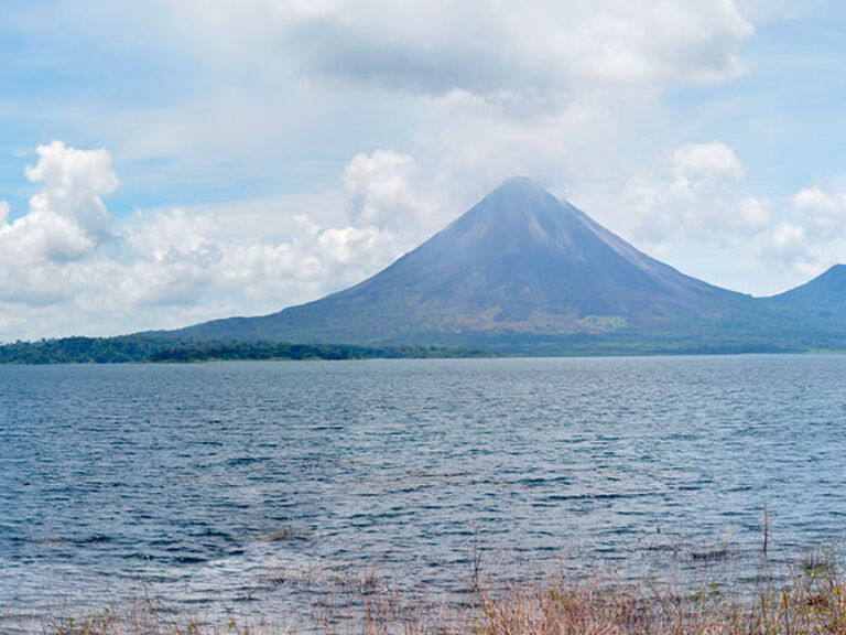 Located in Costa Rica's heartland, Arenal Lake is a must-visit destination surrounded by lush rainforest and diverse wildlife. Ideal for swimming, fishing, kayaking, and hiking, the area also features boat tours for an immersive experience.