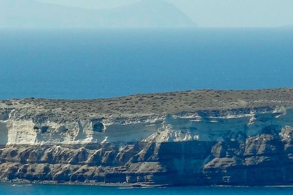 Aspronisi Island: Discover Greece's Unspoiled Gem Aspronisi, also known as Strogili, is an uninhabited rocky island in the South Aegean, west of Santorini. Experience its stunning terracotta cliffs and embrace the tranquility of this spiritual haven. A must-visit on your Greek holiday.
