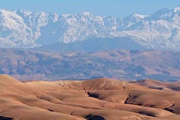 The Agafay Desert near Marrakech, Morocco, offers stunning landscapes with canyons, plains, and stony hillsides. Ever-changing light conditions and vibrant sunsets make this desert a remarkable destination worth exploring.