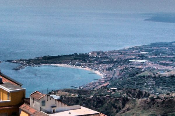 Castelmola is a small town in the province of Messina, located on the northeast coast of Sicily, Italy. It is famous for its stunning views of the Ionian Sea and its historical center, which is characterized by narrow streets and traditional houses.