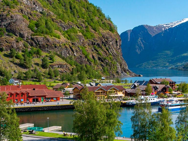 Attractions-in-Flåm: Flåm is a small village located in the innermost part of the Aurlandsfjord, a branch of the Sognefjord in Norway. It is known for its stunning natural beauty and is a popular tourist destination, attracting visitors from all over the world.