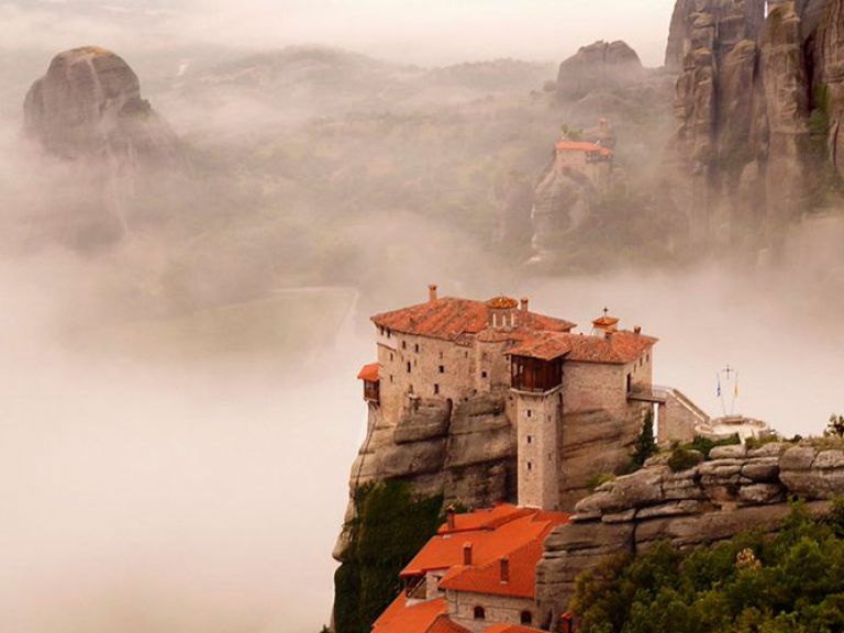 Attractions-in-Meteora: Meteora, in Thessaly, Greece, boasts six preserved monasteries atop striking rock formations. Notable ones include the mid-14th century Holy Monastery of Great Meteoron. This unique historical spectacle draws global travelers.
