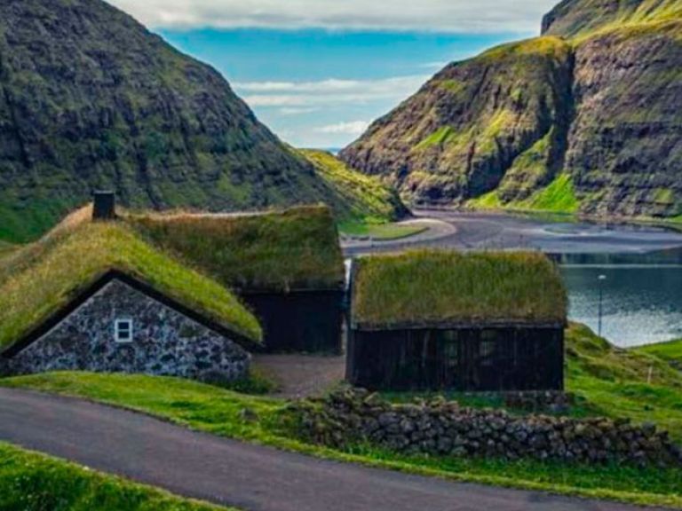 Attractions-in-Saksun: Saksun, a scenic village in the remote Faroe Islands, is renowned for its traditional Faroese architecture and stunning natural landscapes. Nestled on Streymoy's western coast, it offers breathtaking views of fjords.