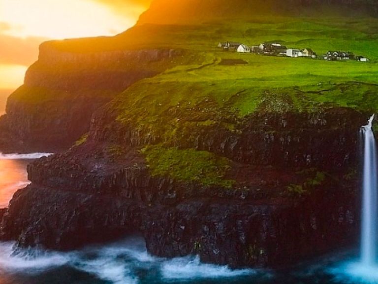 Attractions-in-Vágar-island: Vágar Island, a popular Faroe Islands tourist spot, offers stunning natural beauty, rugged landscapes, and quaint villages. Its top attraction is the breathtaking Sørvágsvatn Lake, also known as Leitisvatn.