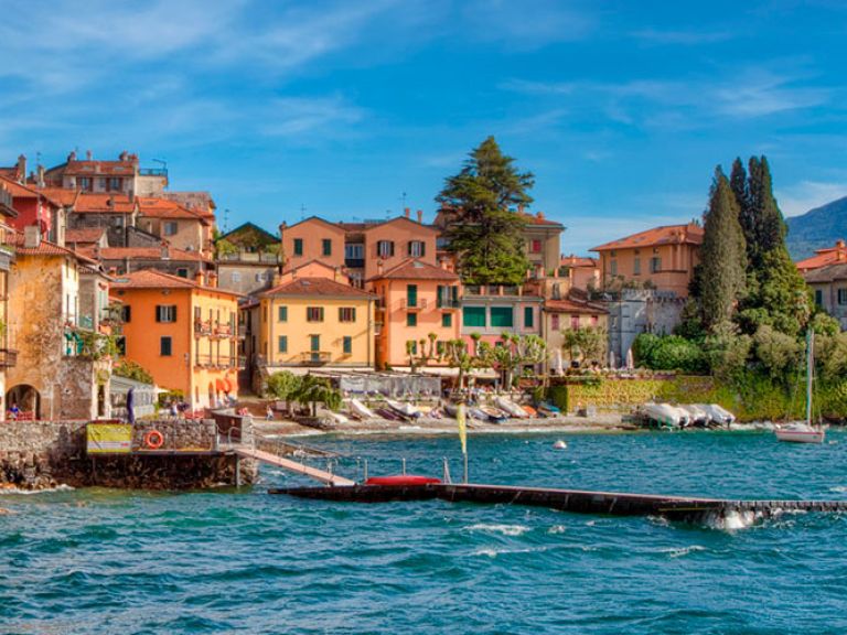 Varenna, a picturesque village on Lake Como's eastern side, charms with vibrant houses, cobbled lanes, and stunning lake views. Visitors can explore the Castle of Vezio, dine at waterfront cafes, admire beautiful gardens, or ferry to nearby towns.