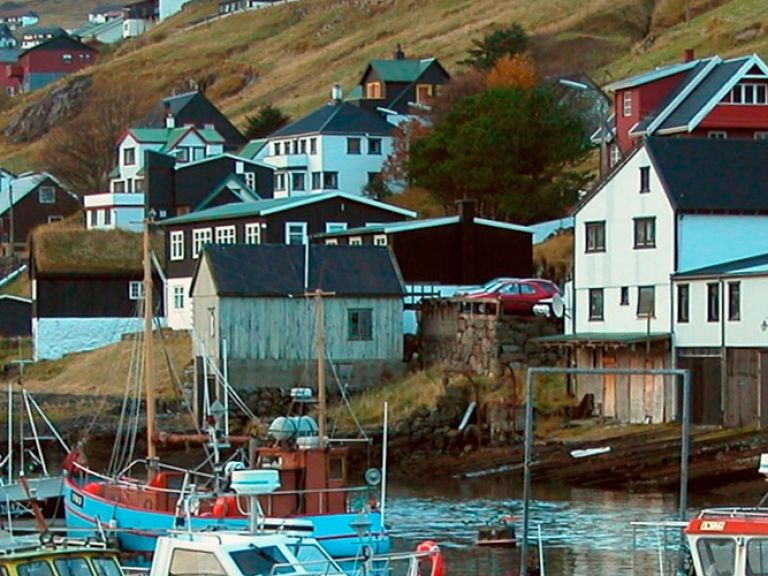 Attractions-in-Vestmanna: Vestmanna, a charming village on Streymoy's western coast, attracts tourists with its dramatic landscapes and unique adventures, like boat tours of the captivating Vestmanna Sea Cliffs.