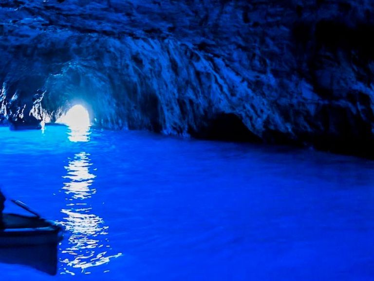 Capri's must-visit Blue Grotto features stunning, sunlight-illuminated blue waters within a sea cave. Accessible by boat, you can marvel at the radiant waters and natural cave formations, promising an unforgettable, mesmerizing experience.