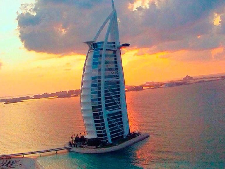 Burj Al Arab in Dubai is an iconic luxury hotel, known for its sail-like design. It offers stunning city and Gulf views, ranking among the world's most luxurious hotels.