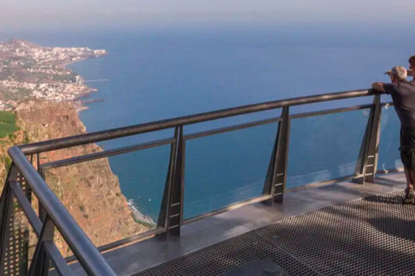 Cabo Girão, towering above the Atlantic Ocean, is one of Madeira Island's iconic landmarks. Visit the second highest sea cliff in the world and marvel at the breathtaking views from its glass-floored skywalk. Capture unforgettable moments as you witness the dramatic cliffs plunging into the azure waters below.