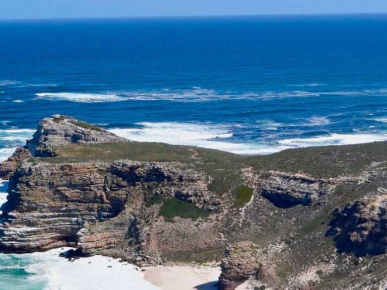 The Cape of Good Hope, a World Heritage Site in South Africa, is famed for its rich bio-diversity, including over 1,700 plant species. A symbol of natural beauty, it's a must-see for visitors.