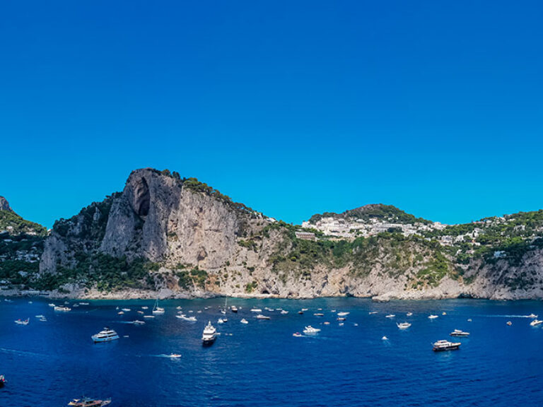 Capri is a beautiful island located in the Gulf of Naples. It is known for its dramatic cliffs, stunning coastline and luxury hotels. Anacapri is the highest point on the island and offers panoramic views of the Tyrrhenian Sea.