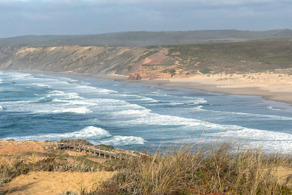 Carrapateira, a charming village on Portugal's Costa Vicentina, is a hidden gem for nature enthusiasts. Enjoy its unspoiled beaches, such as Praia do Amado, ideal for surfing and sunbathing. Explore the surrounding natural park, hike along scenic trails, and immerse yourself in the laid-back atmosphere of this coastal haven.