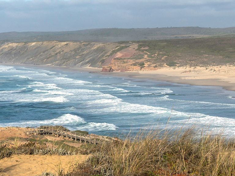 Carrapateira, a charming village on Portugal's Costa Vicentina, is a hidden gem for nature enthusiasts. Enjoy its unspoiled beaches, such as Praia do Amado, ideal for surfing and sunbathing. Explore the surrounding natural park, hike along scenic trails, and immerse yourself in the laid-back atmosphere of this coastal haven.