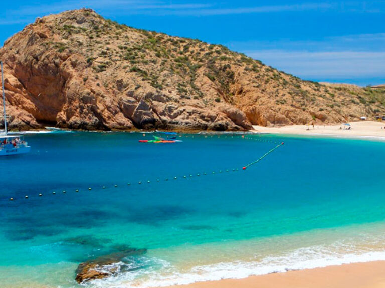Discover the stunning beauty of Chileno Bay in Cabo San Lucas with its clear blue waters and breathtaking cliffs. Enjoy swimming, sunbathing, fishing, kayaking, snorkeling, and scuba diving in this vibrant marine paradise.