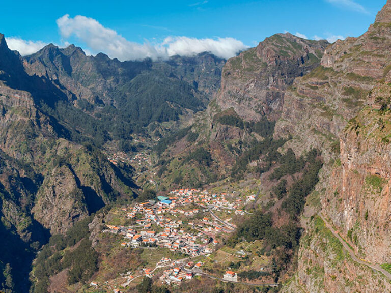 Curral das Freiras is a tiny village located in a valley surrounded by mountains. It's a place of great natural beauty, with lush vegetation and clear waters. The village is home to a small community of farmers and fishermen who live off the land.