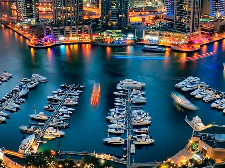 Dubai Marina, in the heart of "new Dubai", boasts a 3.5km canal, residential towers, yachts, shops, and restaurants. Offering stunning skyline views and the Arabian Gulf, it's a favorite for locals and tourists.