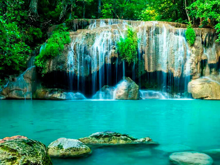 Erawan National Park is a stunning natural wonder located in West Thailand. The park is home to the Erawan Falls, one of the most popular falls in the country. The falls are made up of seven tiers, each with its own unique features. The waters flow over limestone formations and through dense forest, creating a picturesque and serene setting. Visitors can enjoy hiking, swimming, and picnicking in the park.