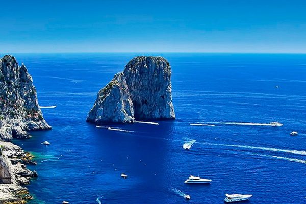 Faraglioni rocks Capri: Nestled in the enchanting embrace of the Mediterranean Sea, the Faraglioni rocks of Capri stand tall as iconic sentinels of this idyllic island.