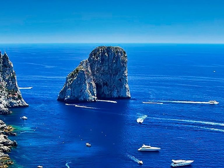 Faraglioni rocks Capri: Nestled in the enchanting embrace of the Mediterranean Sea, the Faraglioni rocks of Capri stand tall as iconic sentinels of this idyllic island.
