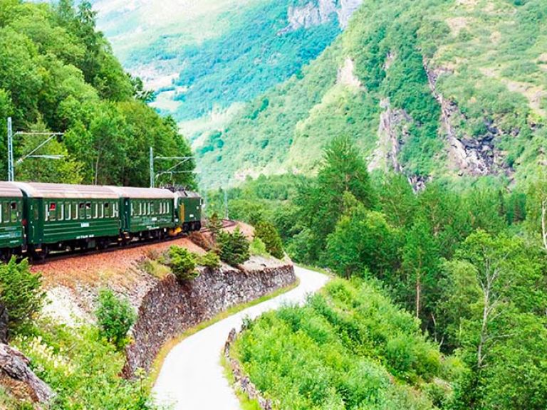 Experience the awe-inspiring Flåm Railway, a 20-kilometer journey through Norway's stunning landscapes. Built in 1940, it's one of the world's steepest standard-gauge railways, reaching gradients of up to 5.5%.